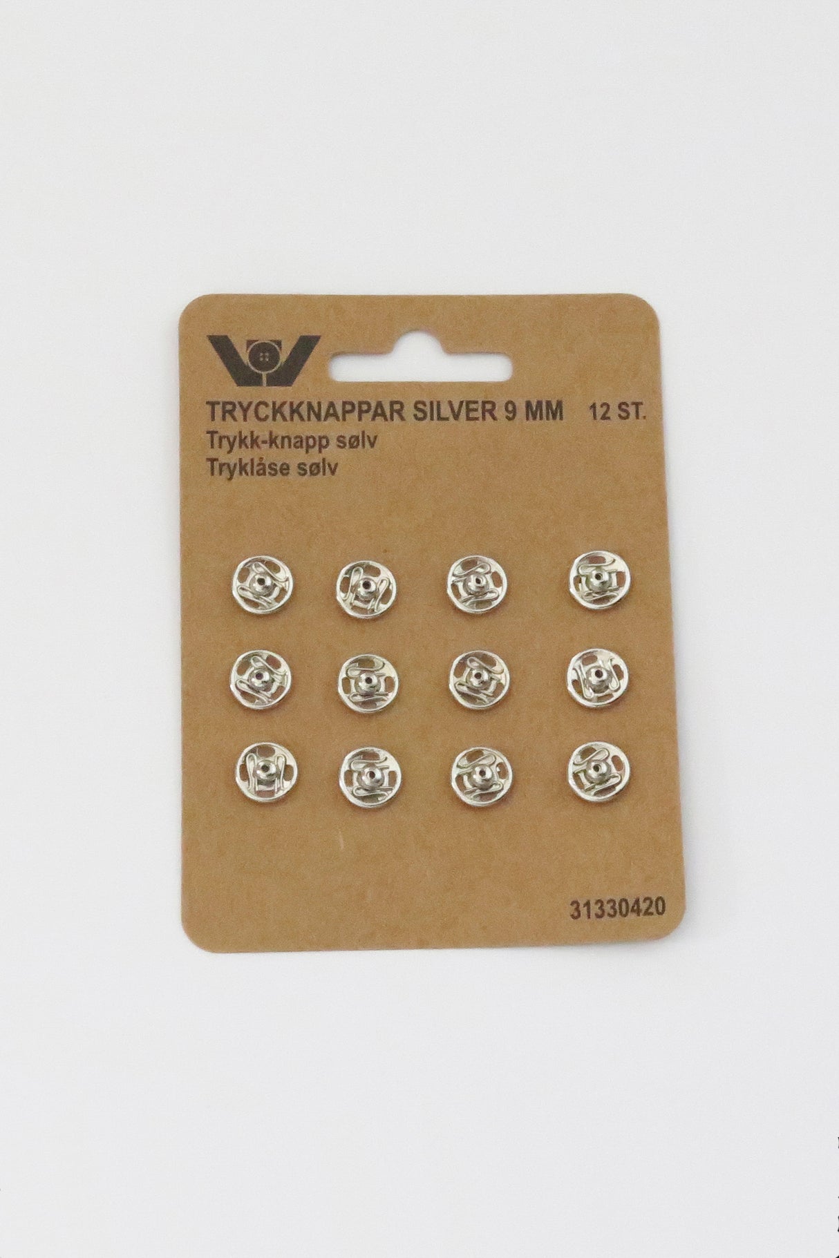 Button with four holes in olive wood