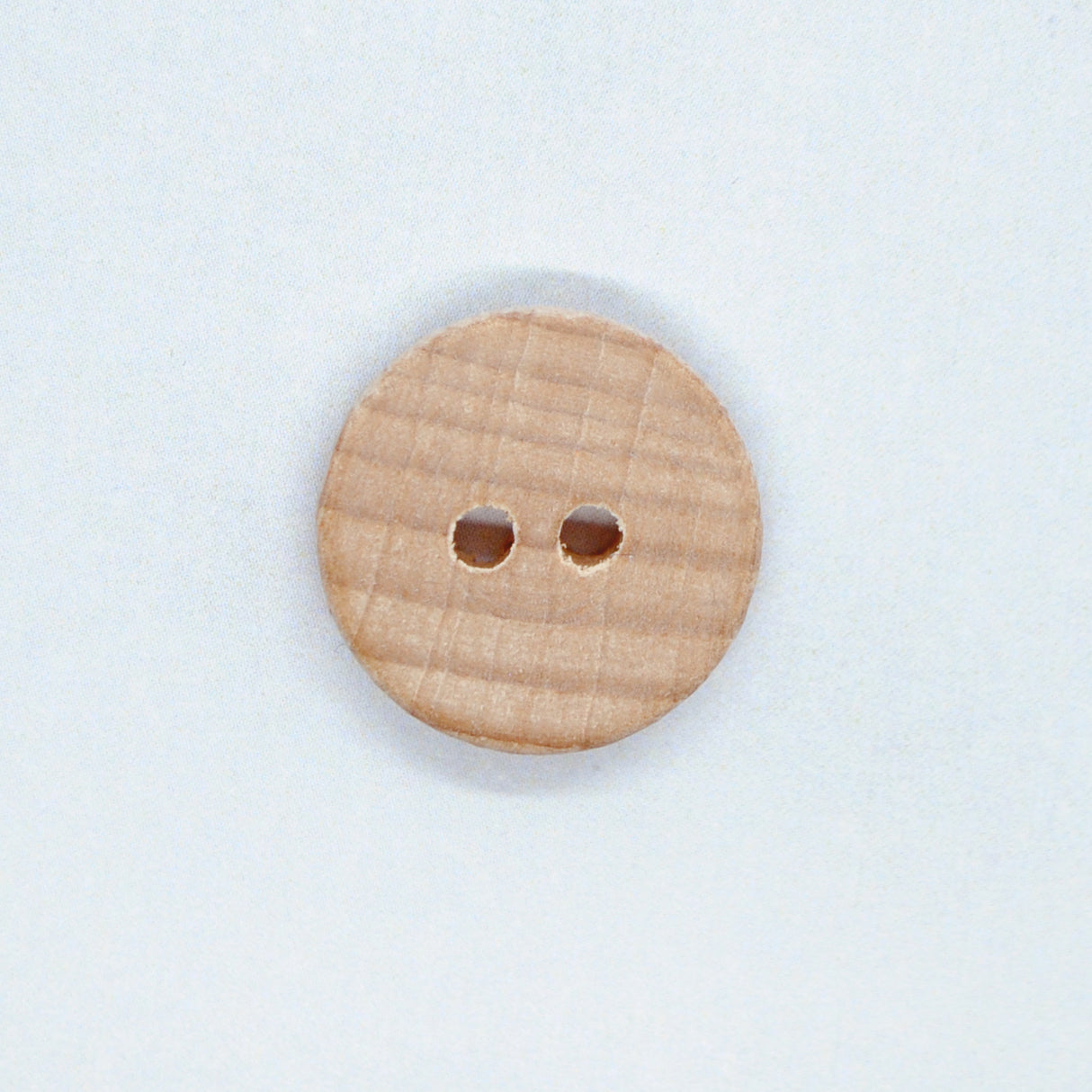 Button with shimmer